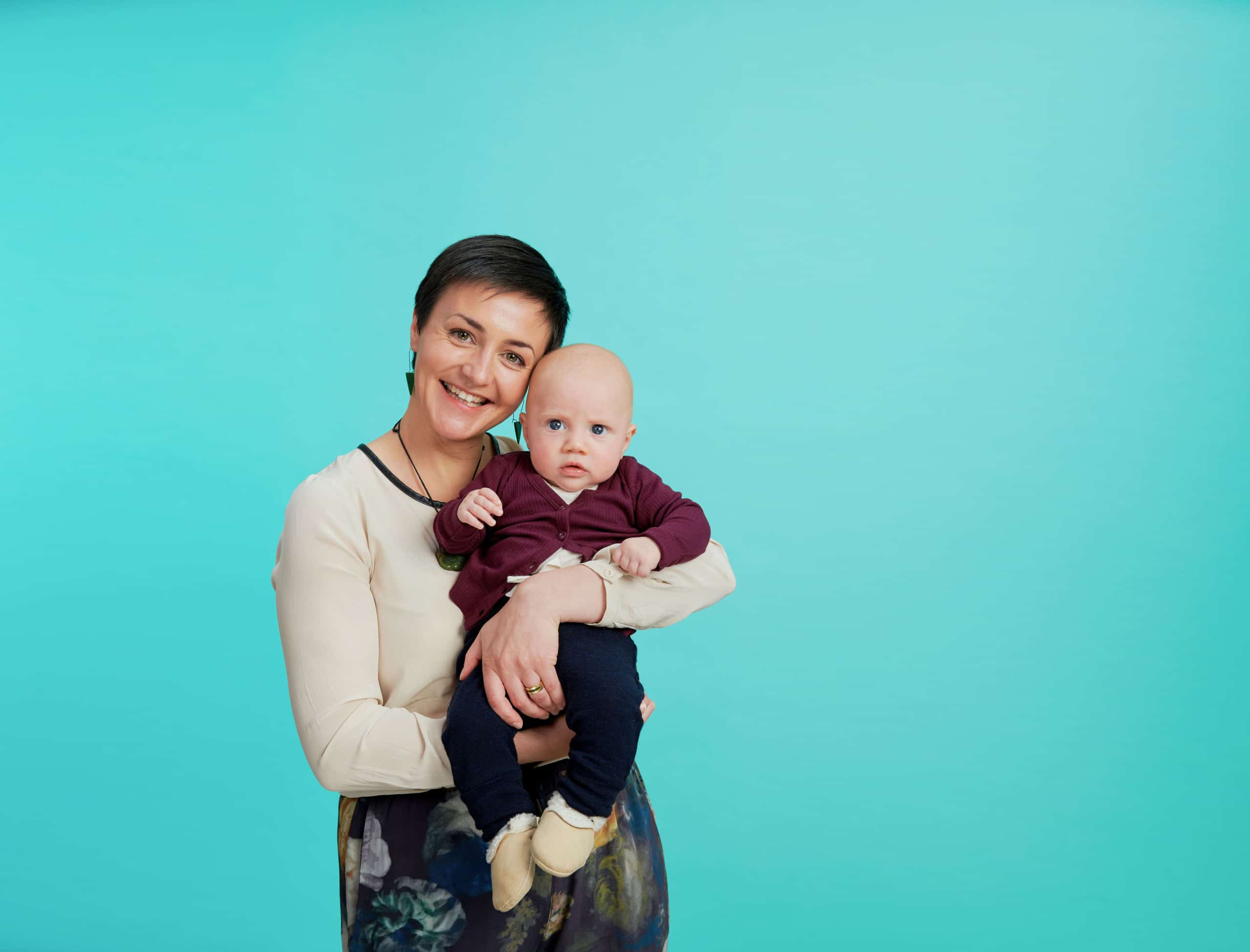 A miniý Māori Fellow holding her baby